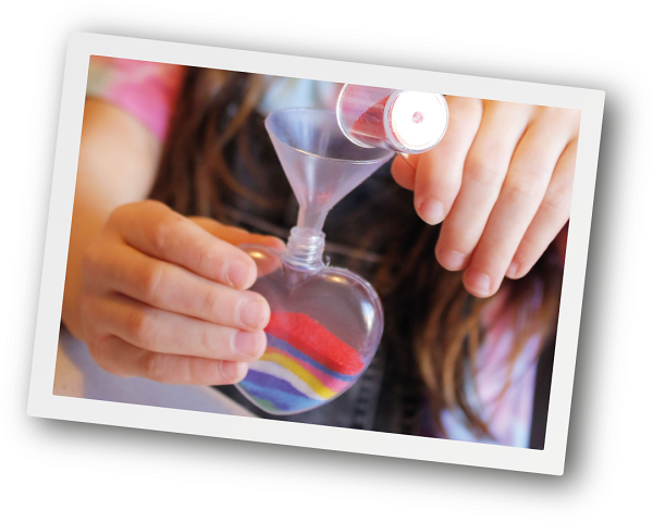 Girl making heart pendant
